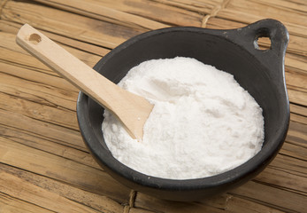baking soda (Sodium bicarbonate) on a wooden spoon