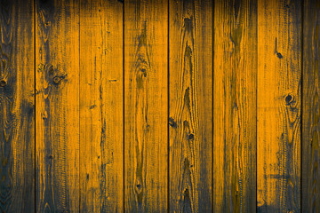 Obraz premium Old wooden yellow painted peeling off planks, texture background