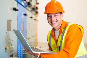 Fototapeta premium electrical worker with laptop computer