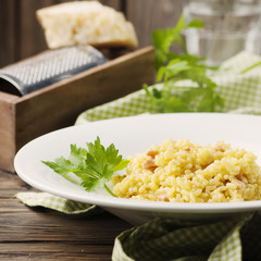 Italian traditional risotto with saffron and ham