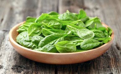 Baby spinach in a wooden plate