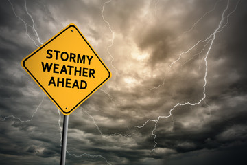 Sign with words 'Stormy weather ahead' and thunderclouds - 102690152
