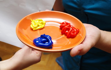 colorful paint on a plate ready to use