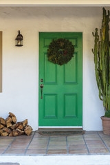 Narrow front door with wreath