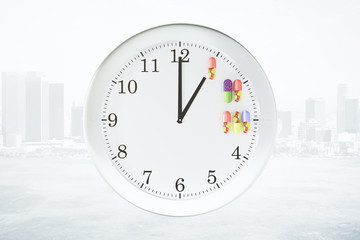 Receiving medication on a schedule concept with wall clock and p