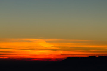 Mountain silhouette on red sunset