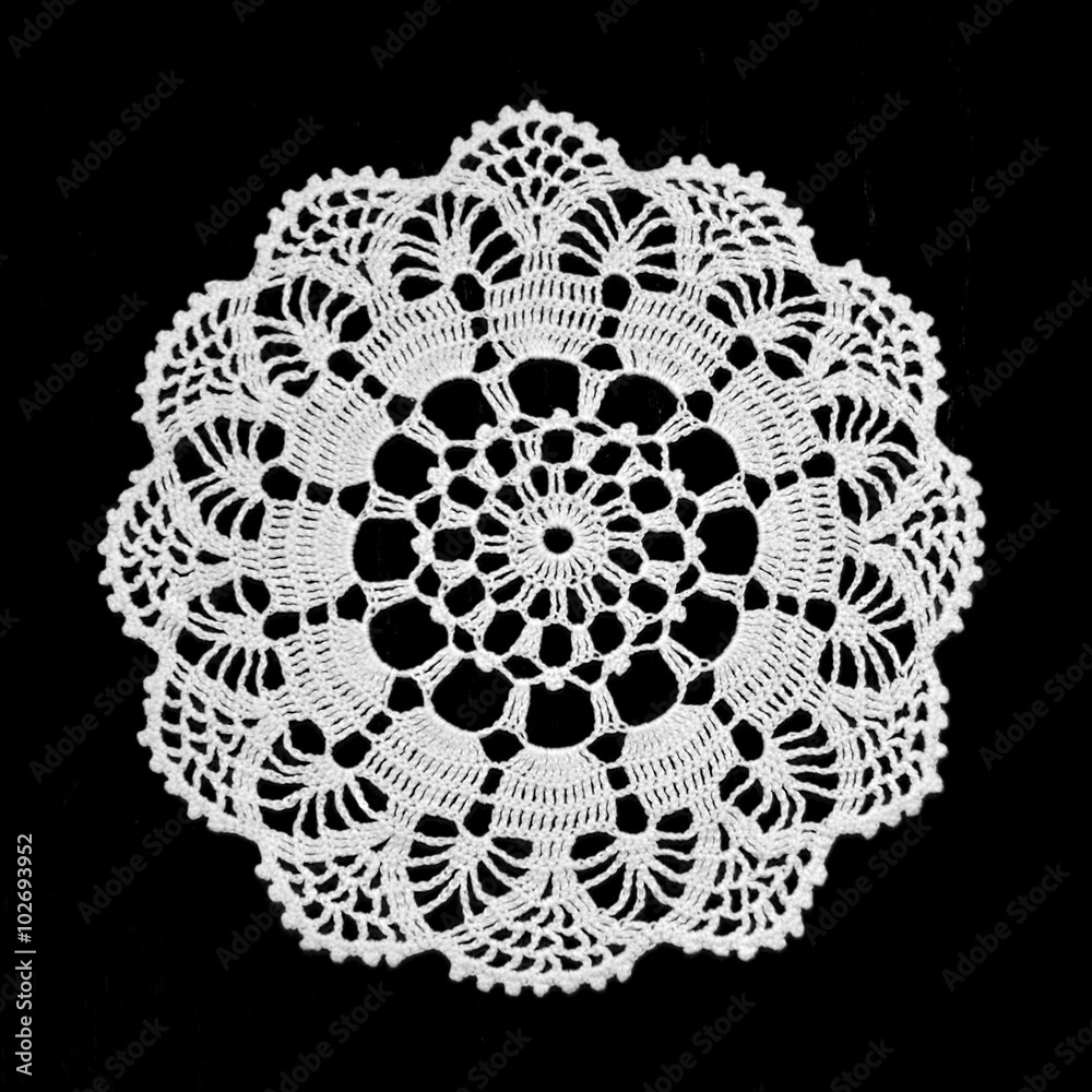 Wall mural Doily isolated on black background