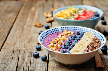 Blueberries and strawberries healthy smoothies breakfast bowls w