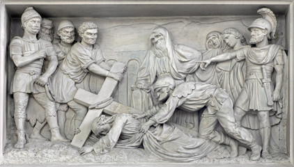 Fototapeta na wymiar Mechelen - Stone relief Jesus fall under cross