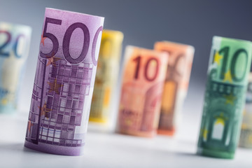 Several hundred euro banknotes stacked by value.Rolls Euro  banknotes.Euro currency money.Announced cancellation of five hundred euro banknotes. Banknotes stacked on each other in different positions