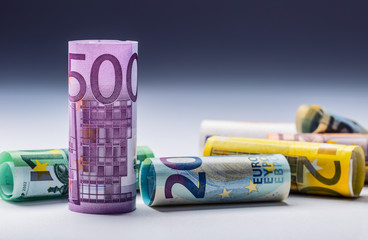 Several hundred euro banknotes stacked by value.Rolls Euro  banknotes.Euro currency money.Announced...