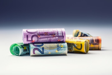 Several hundred euro banknotes stacked by value.Rolls Euro  banknotes.Euro currency money.Announced cancellation of five hundred euro banknotes. Banknotes stacked on each other in different positions