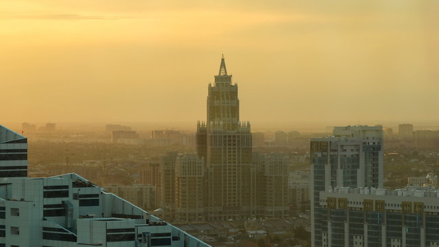 Triumph of Astana building timelapse at sunset time from the top of Baiterek tower. Astana, Kazakhstan