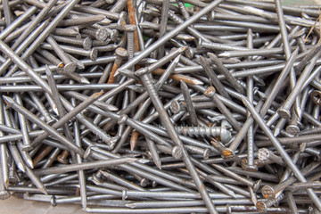 Heap of old steel nails, with selective focus. close up, as background,