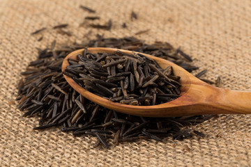 Wild brown rice in spoon