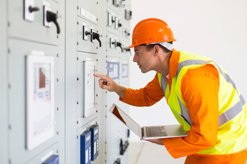 power company technical worker using laptop computer