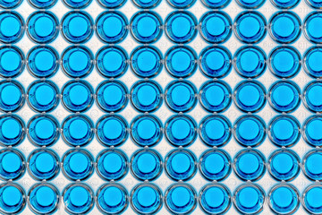 A 96 well plate with blue samples