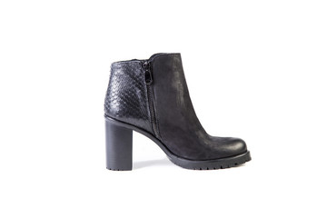 Suede women's boots on a white background, black shoes, autumn and winter, side view