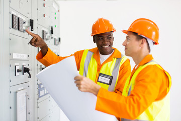 industrial technicians working in control room