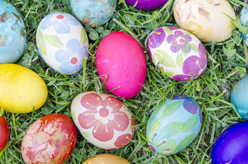 Hand painted decoupage Easter eggs on the grass