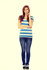 Happy teen woman with folded arms