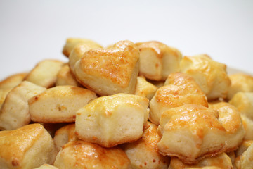 Cheese biscuits on white background, close-up view