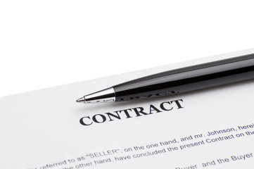 Close-up of pen on contract