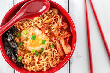 Korean Ramen with Kimchi on white wood