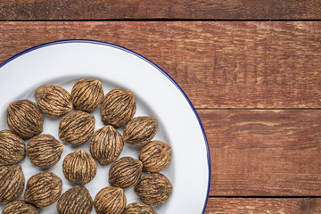 black walnuts a white plate