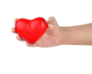 Hands holding a red heart as symbol for love and care