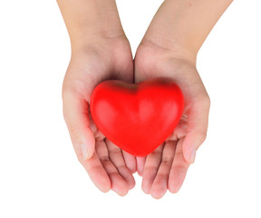 Fototapeta premium Hands holding a red heart as symbol for love and care