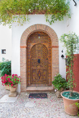 Granada - The door of house in mudejar style.