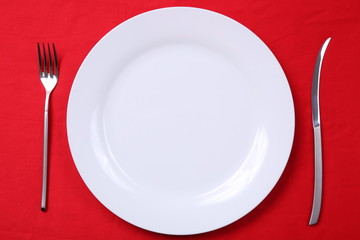 fork and knife with red background