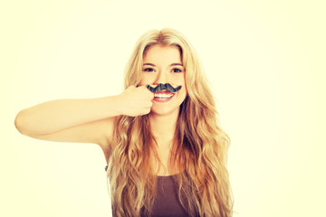 Blonde student with mustache looking at camera