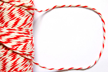 White and red thread in white background