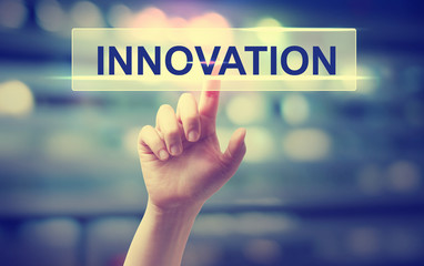 Innovation concept with hand pressing a button