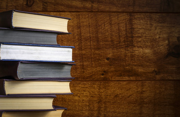 Old book on wooden background.