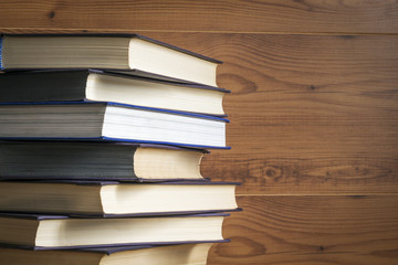 Old book on wooden background.