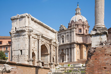 Fototapeta na wymiar Rome - Forum romanum and the Triumph arch of Septimus Severus and st. Lucke chruch.