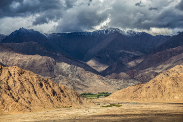Fototapeta na wymiar Gathering storm in Himalayas mountains. Ladakh, India