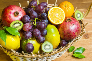 Mix of fresh fruits on wicker bascket