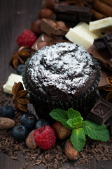 chocolate muffins with icing sugar and ingredients, vertical