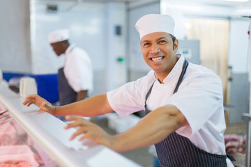 mature male butcher looking at the camera