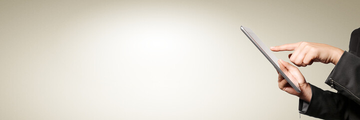 Businesswoman hands holding a tablet touch computer gadget isolated. Free space for text.