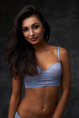 Fototapeta na wymiar beautiful indian lady in blue lingerie