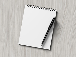 Blank note paper with pen. on wood background