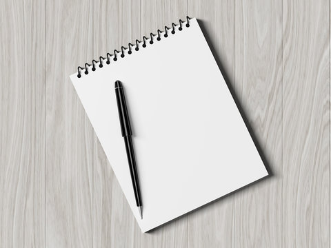 Blank note paper with pen. on wood background