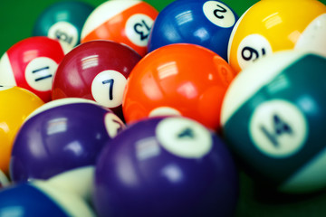 billiard balls on a green pool table, closeup