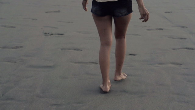 Beautiful woman walking on the beach super slow motion, shot at 240fps
