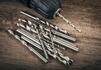 Drill and set of drill bits